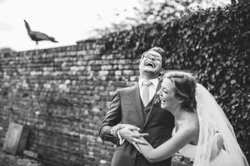Wedding couple laughs