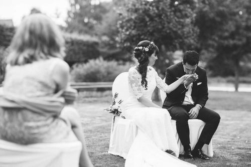 Groom kisses bride's hand